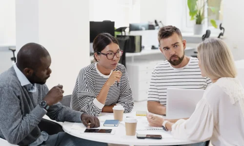 close-up-young-colleagues-having-meeting_service